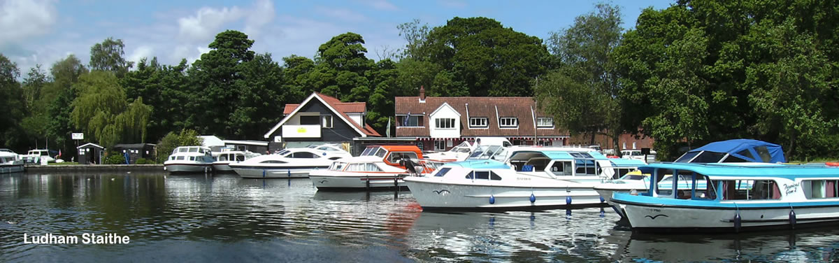 Womack Staithe on the Norfolk Broads with hire boats moored